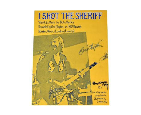 ERIC CLAPTON; sheet music for 'I Shot the Sheriff', bearing his signature and two others.We have not authenticated these sign