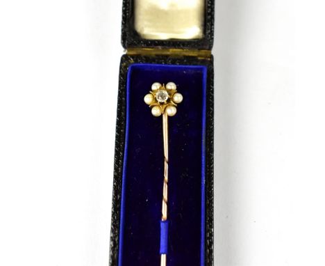 A Victorian tiepin set with diamond and seed pearl cluster, on yellow metal pin, length 6.4cm.