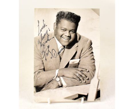 FATS DOMINO; a black and white promotional photograph bearing his signature.We have not authenticated this signature, please 