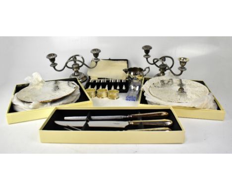 Various silver plated ware to include a pair of twin-branch candelabra, boxed Arthur Price place mats and carving set, a case