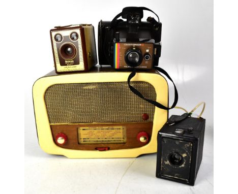 Two box cameras in cases and a Polaroid Land Camera Colour Swinger II, together with a Cambridge Edward Radio Model P117 (4).