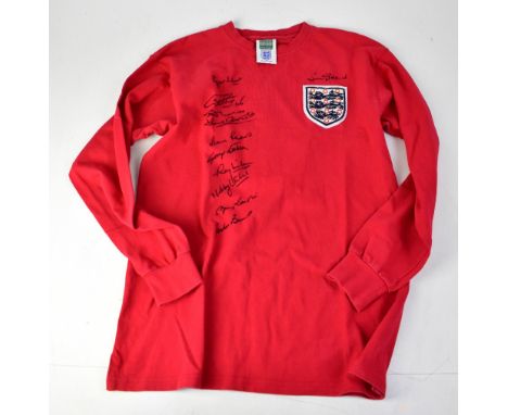 ENGLAND WORLD CUP WINNERS 1966; a vintage football shirt bearing the signatures of Roger Hunt, Geoff Hurst, Jackie Charlton, 