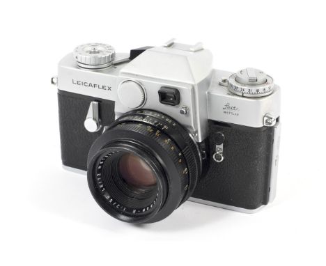 A silver Leica Leicaflex 35mm SLR camera. With a 50mm 1:2 Summicron-R lens. Serial number 1169090