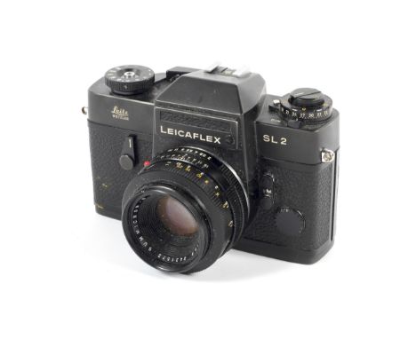 A black Leica Leicaflex SL2 35mm SLR camera. With 50mm 1:2 Summicron R lens. Serial number 1392350 Condition Report: Shutter: