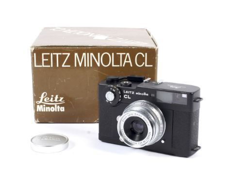 A black Leitz Minolta CL 35mm rangefinder camera. With a Leica 35mm 1:3.5 Summaron lens. Camera body serial number 1035444, l