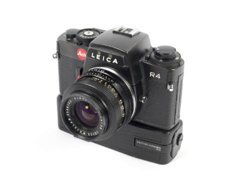 A black Leica R4 35mm SLR camera. With a 35mm 1:2.8 Elmarit-R lens and a motor winder R4, camera serial number 1624999 Condit