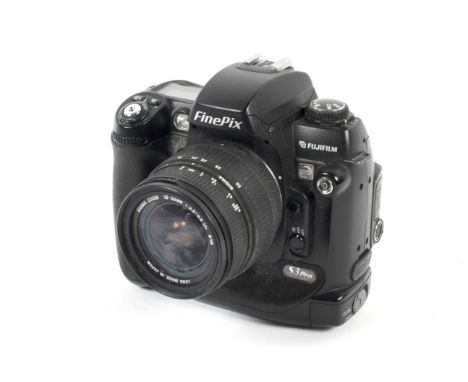 A Fujifilm FinePix S3 Pro Nikon F mount digital SLR camera. With an 18-50mm 1:3.5-5.6 Sigma Zoom lens