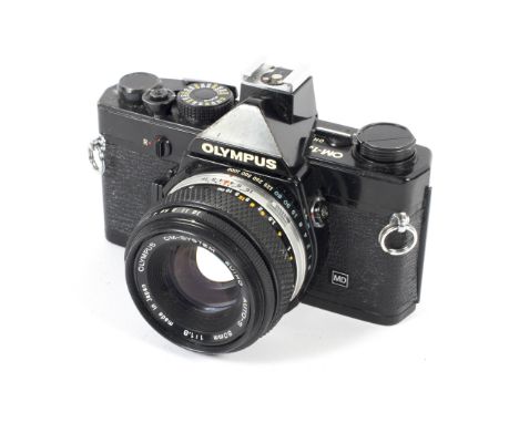 An Olympus OM-1N 35mm SLR camera. Black, with a 50mm 1:1.8 Zuiko Auto-S lens