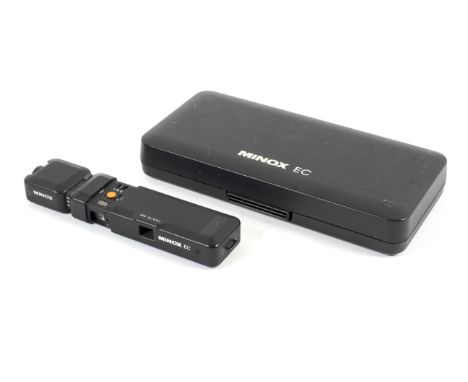 A Minox EC sub-miniature spy camera and a Minox Magicube flash attachment