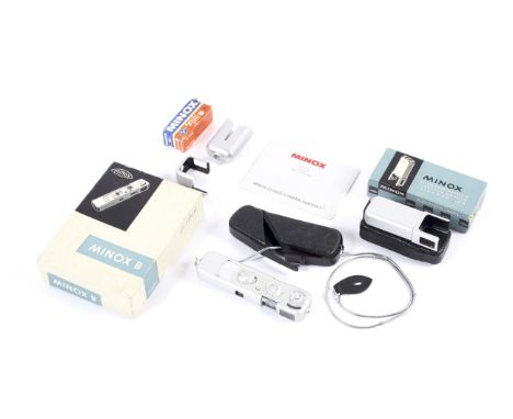 A Minox B sub-miniature spy camera. With a Minox Model B flash gun attachment both in original boxes and cases, together with