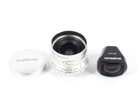 A Voigtlander camera lens and a 25mm shoe mount viewfinder. The first 25mm 1:4 MC Snapshot-Skopar M39 screw mount, serial num
