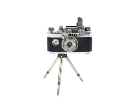 A Lumix lighter in the form of a Leica rangefinder camera on a tripod