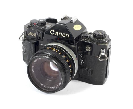 A Canon A1 35mm SLR camera with a 50mm 1:1.8 lens.