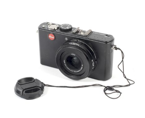 A black Leica D-Lux 4 digital point and shoot camera. Serial number 3642675