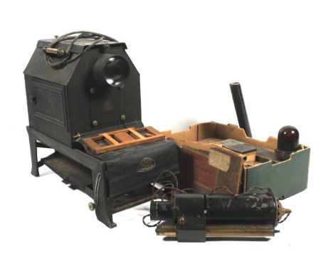 An industrial magic lantern projector, an enlarger, and slides. The first by Ross of London, the second an early vertical enl