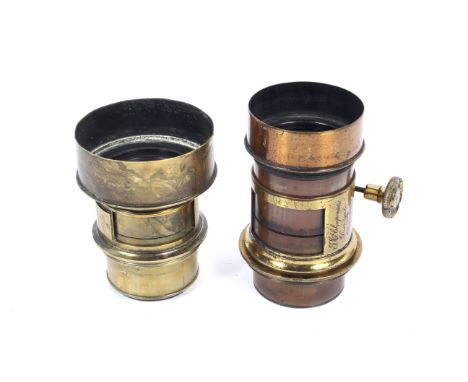 Two brass antique lenses. The first marked Darlot Paris, the second marked A Rofs London. Possibly large format portrait lens