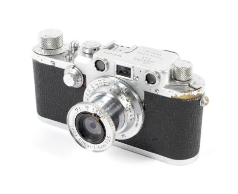 A Leica IIIc 35mm rangefinder camera, chrome, 1950. With a 50mm 1:3.5 Leitz Elmar lens. Camera body serial number 514874.