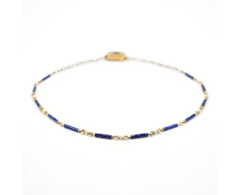 An antique gold enamel and pearl chain necklace. The necklace having blue enamelled bar links with pearls to the chain and an