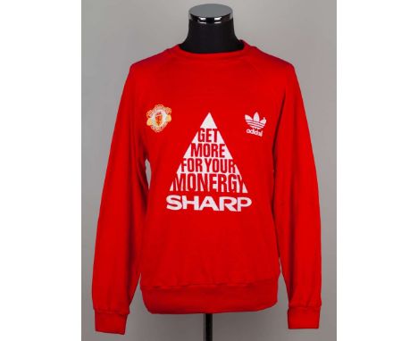 Mike Duxbury red Manchester United long-sleeved sweatshirt, Adidas, with crew-neck collar and embroidered badge inscribed MAN