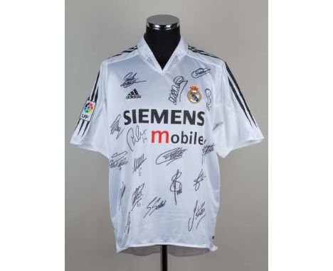 A white Real Madrid autographed shirt, the front bearing numerous player autographs&nbsp;