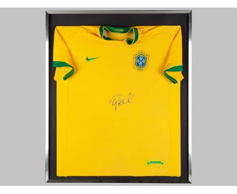 A yellow replica Brazil shirt autographed by Pele, framed, 84 x 72cm overall 