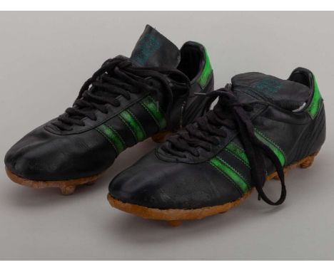 George Best a pair of Adidas black and green football boots, repaired.&nbsp;The following lots 451 to 500 relate to the caree