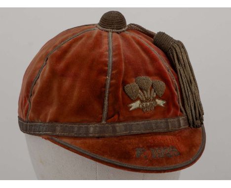 Red Wales v. France rugby union cap, 1928, red velvet cap with gilt tassel and braiding embroidered F. 1928&nbsp;