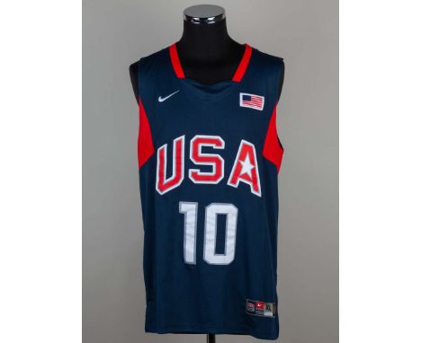 A Kobe Bryant signed USA basketball shirt with COA.