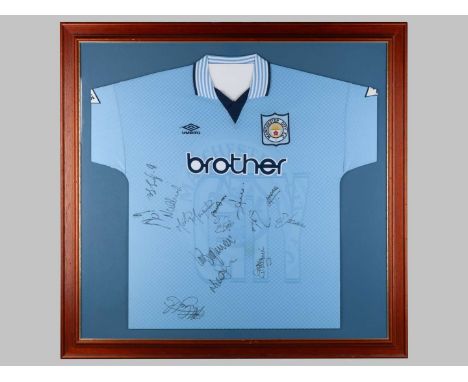 A sky blue Manchester City autographed shirt, 1995-97, the front bearing numerous autographs, framed and glazed, 105 x 107cm