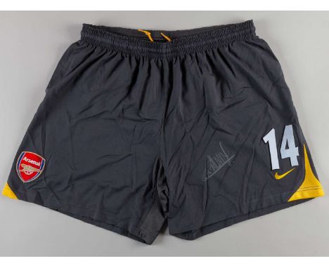 Thierry Henry pair of grey and yellow No.14 match worn shorts, autographed by Henry, Nike, XL.&nbsp;The following lots 700 to