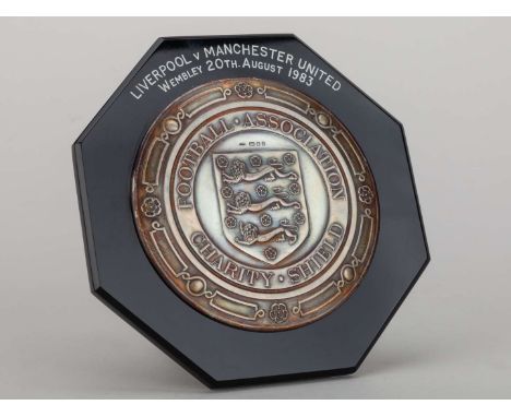 Mike Duxbury a silver-mounted and bakelite Manchester United v. Liverpool Charity Shield plaque, inscribed FOOTBALL ASSOCIATI