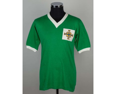 George Best green and white No.7 Northern Ireland v. Scotland match worn short-sleeved shirt, 1964, Bukta, 40, with v-neck co