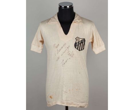 Pelé signed white Santos No.10 shirt, early 1960s, short-sleeved, no maker’s label, signed in black marker with a dedication 