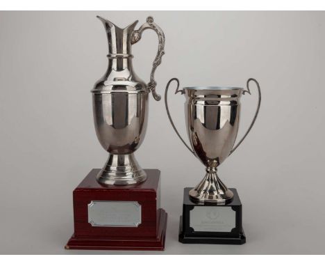 A pair of Dave Bassett golf trophies, the first awarded for the Sir Alex Fergusson Golf Classic Winners, made from white meta