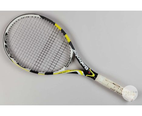 A Rafael Nadal Babolat autographed and match used tennis racquet, signed in black pen on the grip bindings, inscribed "Abu Dh