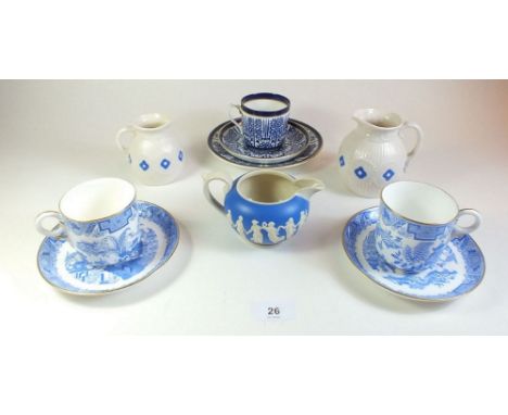 A Coalport trio, two Worcester blue and white coffee cups and saucers and three small decorative jugs 
