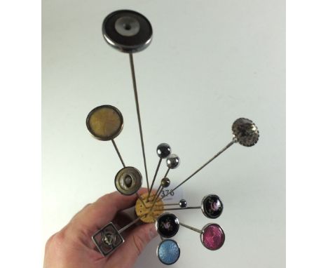 A group of four enamel hat pins and nine others 