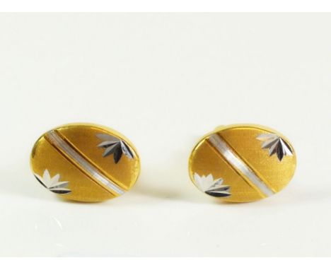 A pair of gentlemans yellow metal cufflinks marked ?916? and ?STM? 