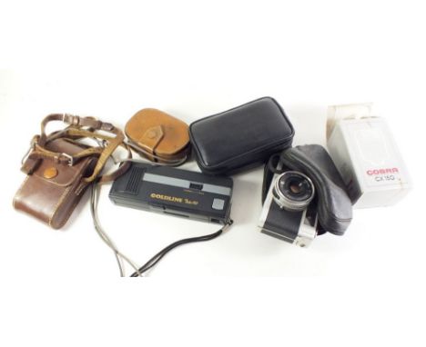 A Konica C35 automatic camera together with various other cameras and accessories 