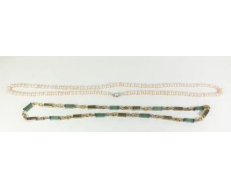 A freshwater pearl necklace together with a Chinese style jade and yellow metal necklace (pearl necklace 98 cm, jade necklace
