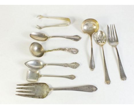 A group of nine items of American sterling silver cutlery to include mote spoon, sauce ladles, caddy spoon etc, 259g 