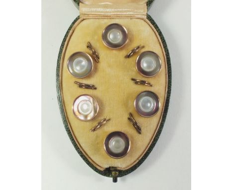 A set of boxed mother of pearl and gilt buttons 