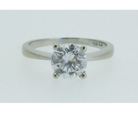 A cubic zirconia solitaire ring with 9 carat white and gold shank, size K ½ 