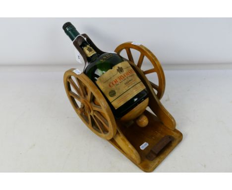 A vintage Courvoisier Fine Champagne VSOP gun carriage form bottle holder with empty Courvoisier bottle, approximately 25 cm 