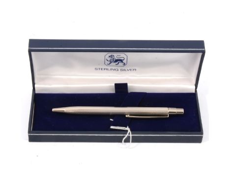 A silver ball point pen by Harrison Brothers &amp; Howson Ltd, London 2011, engine turned design,new and boxed.