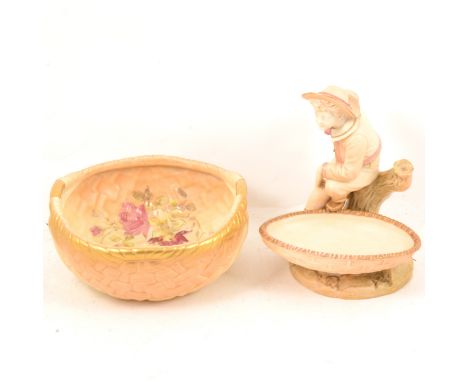 A Royal Worcester blush ivory basket bowl, 22cm; and a figural comport dish with boy, model 1177, 21cm.