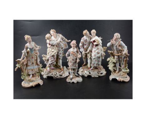 Sitzendorf group, of an amorous young couple, 28cm; a similar group; a pair of Sitzendorf figures, one restored; Sitzendorf f