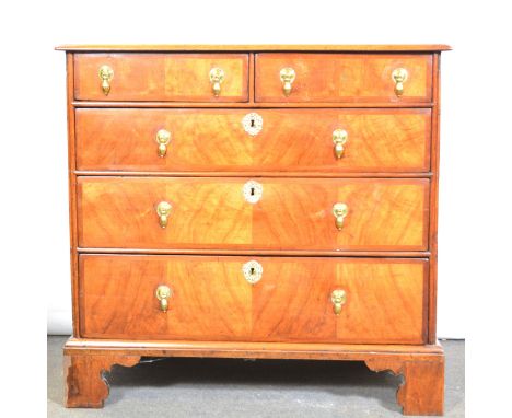 George II walnut chest of drawers, the top with quartered veneers and banding, fitted with two short and three long drawers, 