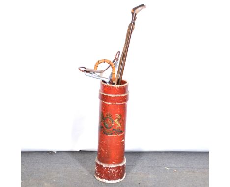 Victorian painted canvas shell case, serving as a stick stand, 70cm; collection of walking sticks and shooting sticks includi