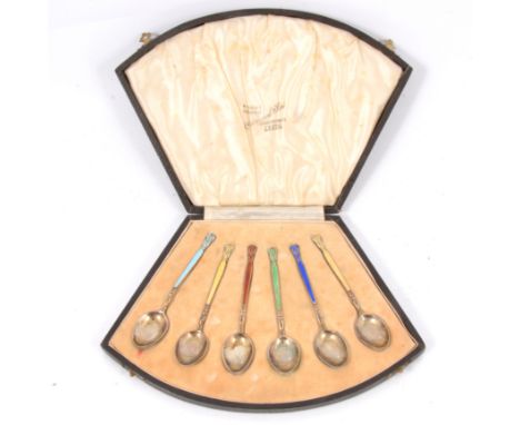 Set of six silver gilt and enamel coffee spoons, indistinctly marked, original box.